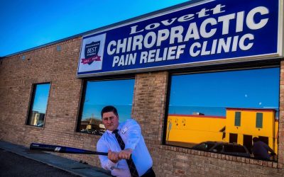 Dr Ky the Bambino outside Lovett Chiropractic playing Baseball